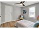 Bedroom with a ceiling fan, and a brightly decorated accent chair at 1195 W Edgewood Ave, Indianapolis, IN 46217