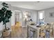 Dining room adjacent to doorway, table setting, hardwood floors, and decor at 1195 W Edgewood Ave, Indianapolis, IN 46217