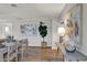 Open-concept dining room with hardwood floors, decor, and a large art piece at 1195 W Edgewood Ave, Indianapolis, IN 46217