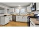 Well-lit kitchen with stainless steel appliances, wood countertops, and white cabinetry at 1195 W Edgewood Ave, Indianapolis, IN 46217