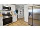 Updated kitchen features stainless appliances, white cabinets, and wood countertops at 1195 W Edgewood Ave, Indianapolis, IN 46217