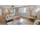Bright living room featuring modern furniture, bay window, and hardwood floors at 1195 W Edgewood Ave, Indianapolis, IN 46217