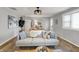 Comfortable living room with hardwood floors, neutral sofa, and stylish decor at 1195 W Edgewood Ave, Indianapolis, IN 46217