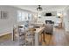 Open-concept living area with dining table and fireplace focal point at 1195 W Edgewood Ave, Indianapolis, IN 46217