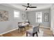 Bright home office featuring a modern desk, neutral decor, and hardwood floors at 1195 W Edgewood Ave, Indianapolis, IN 46217