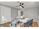 Home office with a modern desk, decorative chairs, ceiling fan, and hardwood floors at 1195 W Edgewood Ave, Indianapolis, IN 46217