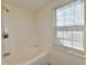 Bathroom with a bathtub and shower combination, with a window at 120 White Lick Dr, Indianapolis, IN 46227