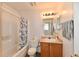 Bathroom with a tub and shower combination, toilet, and vanity with a lighting fixture at 120 White Lick Dr, Indianapolis, IN 46227