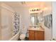 Bathroom with a tub and shower combination, toilet, and vanity with a lighting fixture at 120 White Lick Dr, Indianapolis, IN 46227