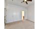 Bedroom with a ceiling fan, a door to the hall, and a doorway to an ensuite bathroom at 120 White Lick Dr, Indianapolis, IN 46227