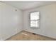 This bedroom features neutral walls, carpet flooring, and a window with natural light at 120 White Lick Dr, Indianapolis, IN 46227