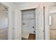 Open closet with bi-fold doors, wire shelving, and access to the washer and dryer hookups at 120 White Lick Dr, Indianapolis, IN 46227
