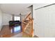 Open foyer featuring hardwood floors, a staircase, and a closet for storage at 120 White Lick Dr, Indianapolis, IN 46227