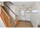 Bright foyer with a staircase, white door, tiled floor, and coat closet at 120 White Lick Dr, Indianapolis, IN 46227
