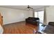Inviting living room with hardwood floors, fan, and sliding doors leading to outdoor space at 120 White Lick Dr, Indianapolis, IN 46227