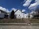 Exterior view of a home with a yard and blue sky at 120 Wisconsin St, Indianapolis, IN 46225