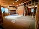 Spacious interior with unfinished framing, exposed beams and old materials at 120 Wisconsin St, Indianapolis, IN 46225