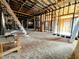 Interior view of a home with exposed framing and unfinished floors at 120 Wisconsin St, Indianapolis, IN 46225