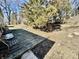 Backyard deck in a yard with several mature trees at 1410 E 8Th St, Anderson, IN 46012