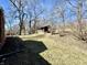 Spacious backyard featuring a shed, mature trees, and plenty of room for outdoor activities at 1410 E 8Th St, Anderson, IN 46012