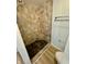 Tile shower with a shower head, a built-in seat, and a sliding towel rack at 1410 E 8Th St, Anderson, IN 46012