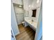 Bathroom featuring a vanity with a white sink and faucet, with a toilet to the left at 1410 E 8Th St, Anderson, IN 46012