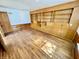 Bedroom featuring wood flooring, built-in shelving, and natural light at 1410 E 8Th St, Anderson, IN 46012