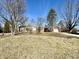 Charming single-story home with brick facade, attached garage, and well-maintained lawn at 1410 E 8Th St, Anderson, IN 46012