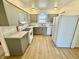Well-lit kitchen featuring updated gray cabinets and modern appliances at 1410 E 8Th St, Anderson, IN 46012
