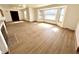Bright living room featuring light wood flooring and a bay window at 1410 E 8Th St, Anderson, IN 46012