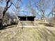Charming shed in the backyard, ideal for storage or a potential hobby space at 1410 E 8Th St, Anderson, IN 46012