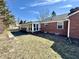 Brick home with an enclosed sunroom and wooden deck for relaxing outdoors at 1410 E 8Th St, Anderson, IN 46012