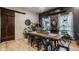 Modern dining room featuring a long wooden table, wooden floors, and elegant decor at 1424 S New Jersey St, Indianapolis, IN 46225