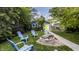 Backyard fire pit with Adirondack chairs and a charming detached garage at 1424 S New Jersey St, Indianapolis, IN 46225