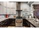 Well-equipped kitchen with stainless steel appliances, granite countertops, and elegant decor at 1424 S New Jersey St, Indianapolis, IN 46225