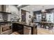 Open kitchen view to dining room featuring stainless appliances, granite countertops and decorative lighting at 1424 S New Jersey St, Indianapolis, IN 46225