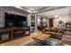Stylish living room with a large TV, built-in fireplace, and comfortable leather sofa at 1424 S New Jersey St, Indianapolis, IN 46225