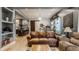 Spacious living room featuring hardwood floors, a comfortable sofa, and an open layout at 1424 S New Jersey St, Indianapolis, IN 46225