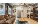 Cozy living room with a comfortable leather sofa, hardwood floors, and natural light at 1424 S New Jersey St, Indianapolis, IN 46225