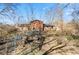 Backyard view of the house showing the chicken coop area and grassy yard at 1431 W Edgewood Ave, Indianapolis, IN 46217