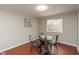 Dining room features a glass table with black chairs and natural light at 1431 W Edgewood Ave, Indianapolis, IN 46217