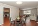 Living room featuring a glass table, seating, and access to kitchen at 1431 W Edgewood Ave, Indianapolis, IN 46217