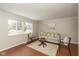 Cozy living room with comfortable seating, area rug and a bright window at 1431 W Edgewood Ave, Indianapolis, IN 46217