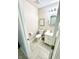 Powder room with tiled floors, toilet, and vanity at 1470 Northern Valley Trl, Avon, IN 46123