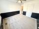 Empty bedroom with neutral carpet, ceiling fan, and modern wainscoting at 1470 Northern Valley Trl, Avon, IN 46123