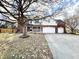 Two-story home with brick and vinyl siding, attached garages, and a well-manicured front yard at 1470 Northern Valley Trl, Avon, IN 46123