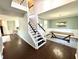 Bright foyer with staircase, hardwood floors, and dining room with elegant chandelier at 1470 Northern Valley Trl, Avon, IN 46123