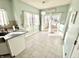 Bright kitchen nook featuring tiled floors, pendant lighting, and sliding glass doors to the porch at 1470 Northern Valley Trl, Avon, IN 46123