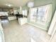 Bright kitchen with tiled floors and a breakfast nook with large windows at 1470 Northern Valley Trl, Avon, IN 46123