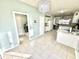 Open concept kitchen with tiled floors, white cabinetry, and stainless steel appliances at 1470 Northern Valley Trl, Avon, IN 46123
